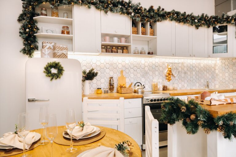 Christmas table decoration in the kitchen, Banquet table with glasses before serving food, close-up