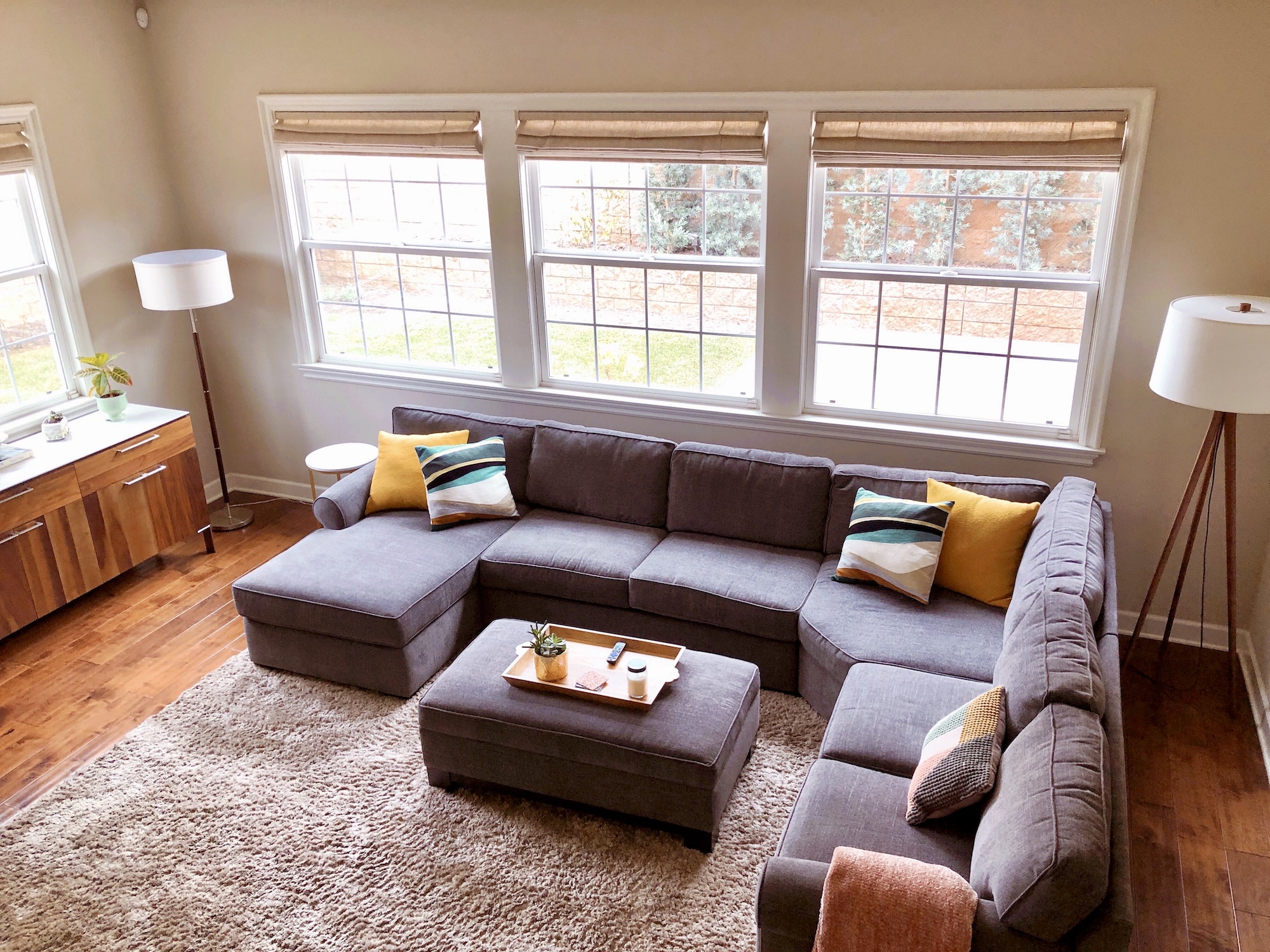 Home decor overhead shot of a couch sectional sofa and ottoman in a living room or family room