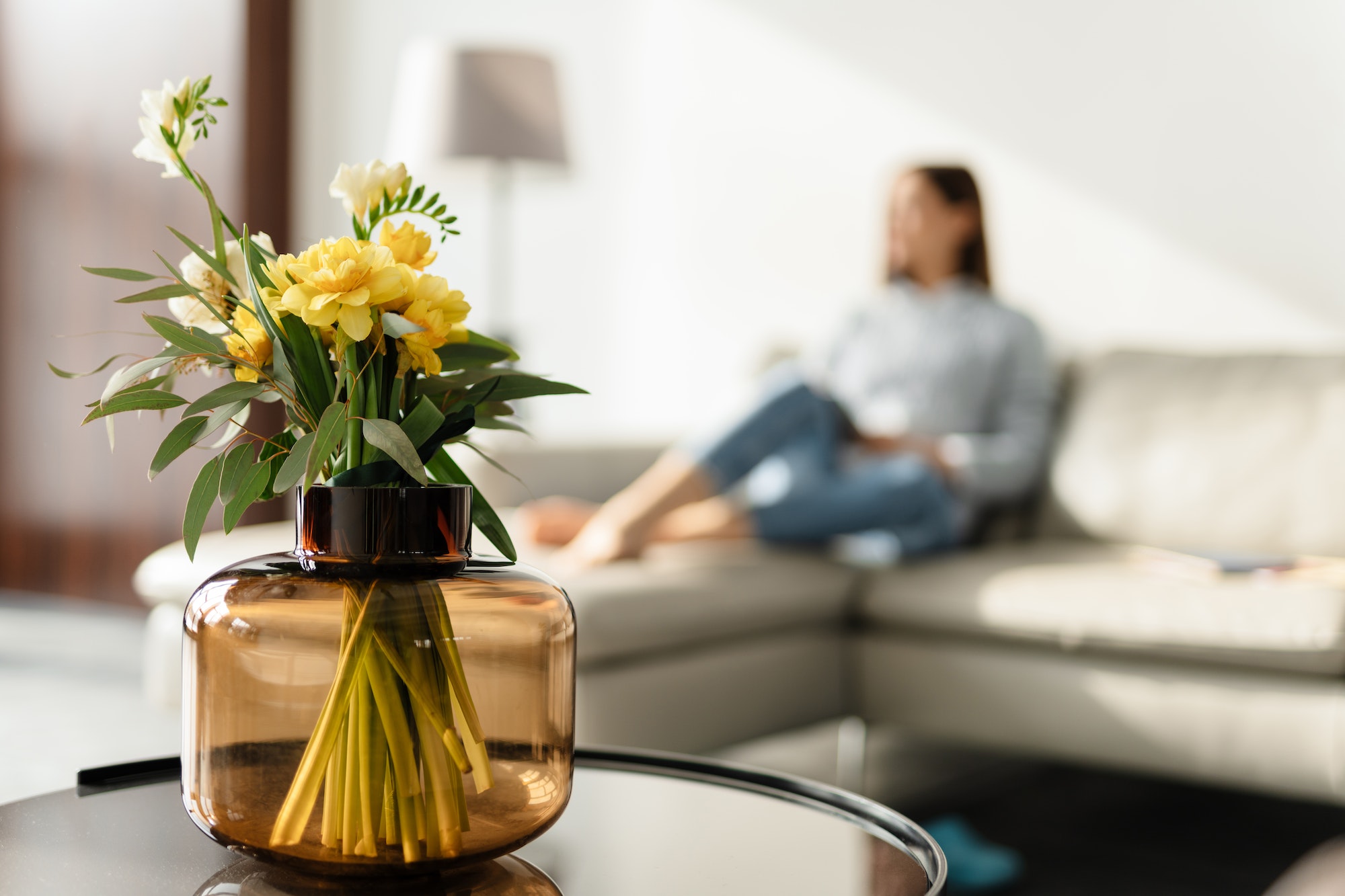 Middle aged woman decorating living room